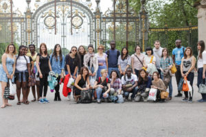 a group of international students posing in front of the parc