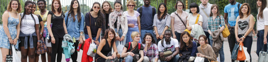 a group of international students posing in front of the parc