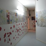 hallway at inflexyon decorated with posters and flowers