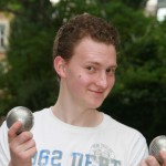 international student playing pétanque